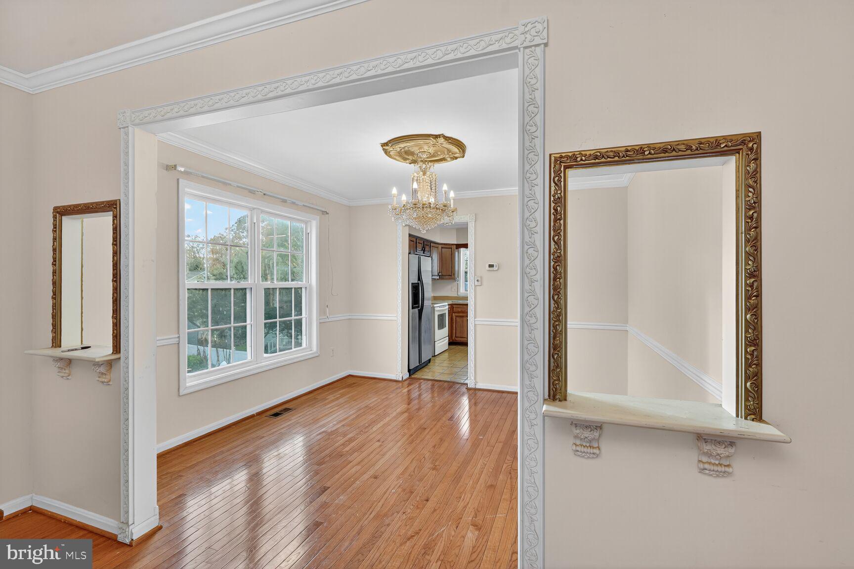 12416 Loft Lane Silver Spring, MD 20904 - Photo 11 of 25 a view of a room with wooden floor and windows