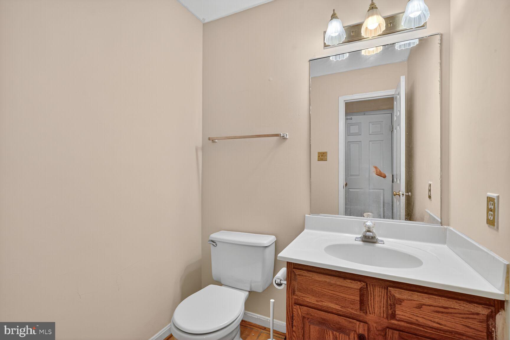 12416 Loft Lane Silver Spring, MD 20904 - Photo 14 of 25 a bathroom with a sink vanity mirror and toilet
