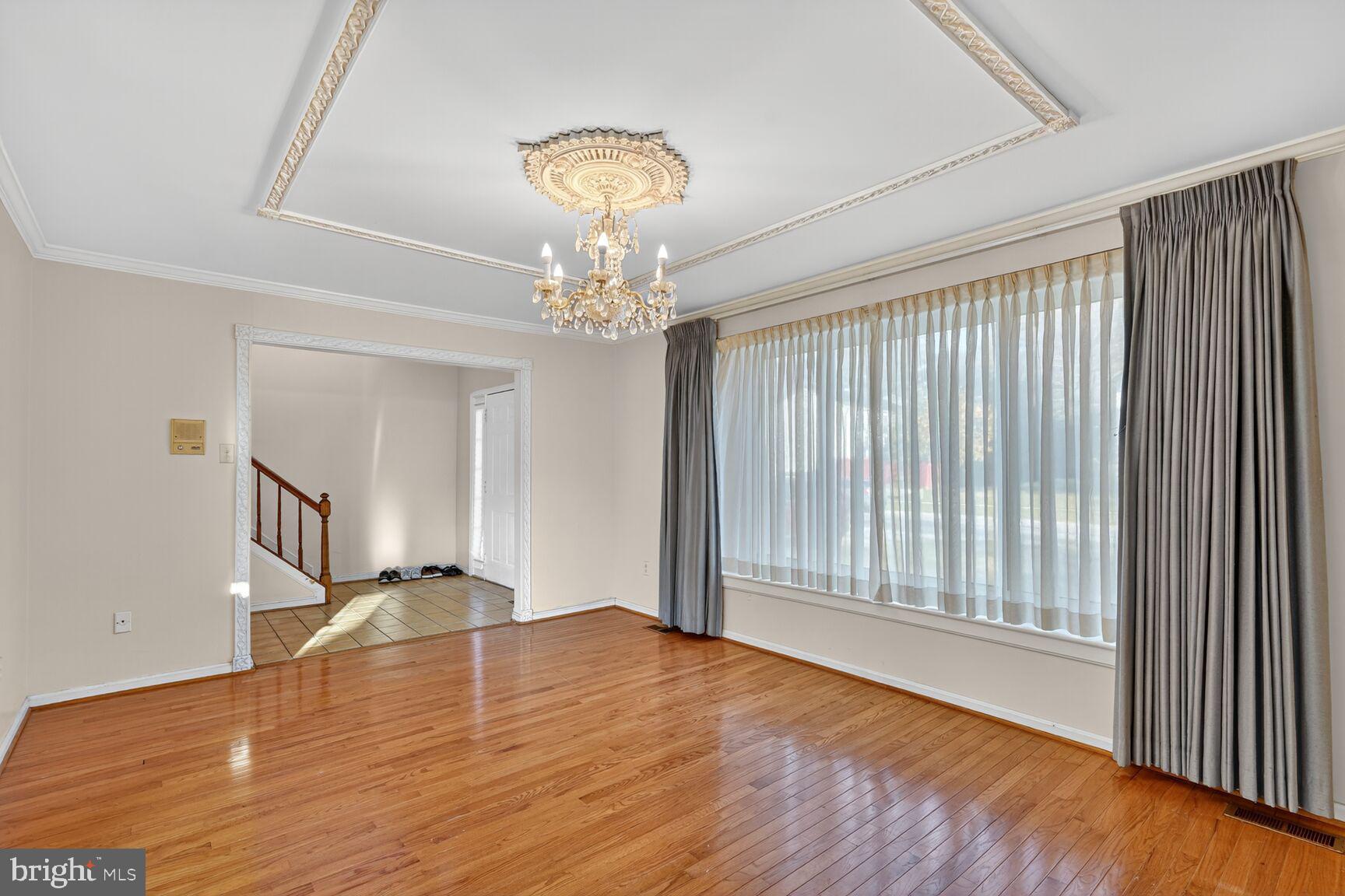 12416 Loft Lane Silver Spring, MD 20904 - Photo 19 of 25 a view of empty room with wooden floor and fan