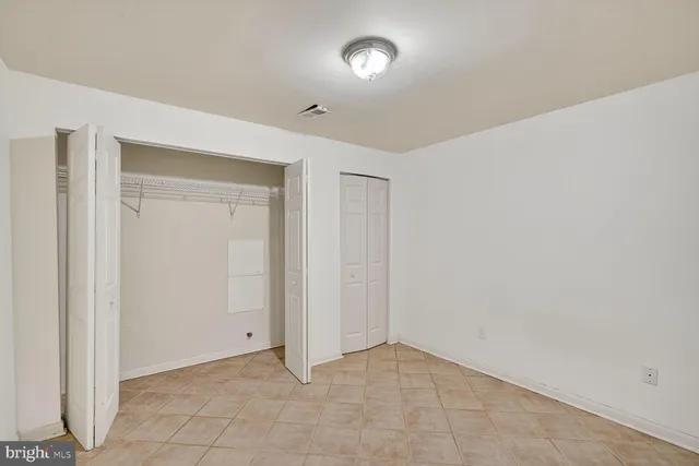 a kitchen with stainless steel appliances a refrigerator and a stove top oven
