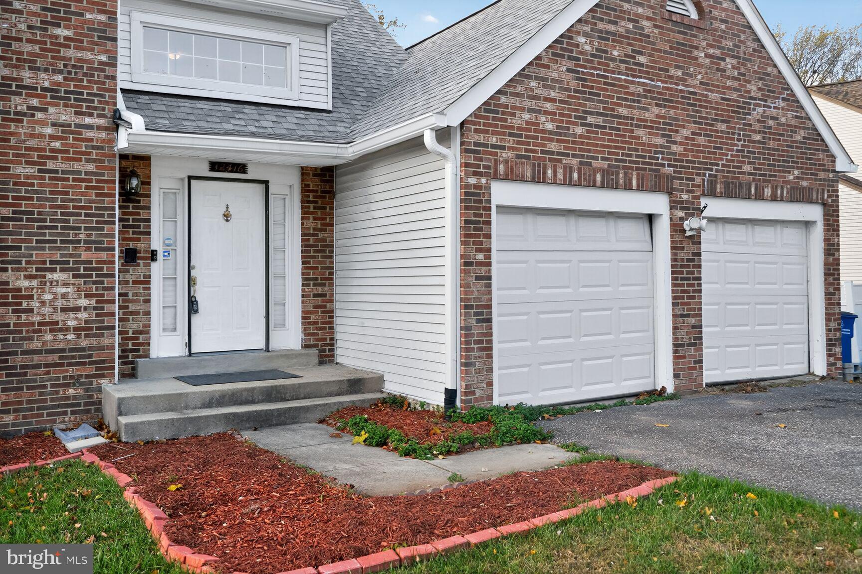 12416 Loft Lane Silver Spring, MD 20904 - Photo 10 of 25 a front view of a house with garden