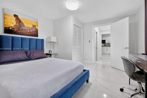 a bedroom with a bed and furniture