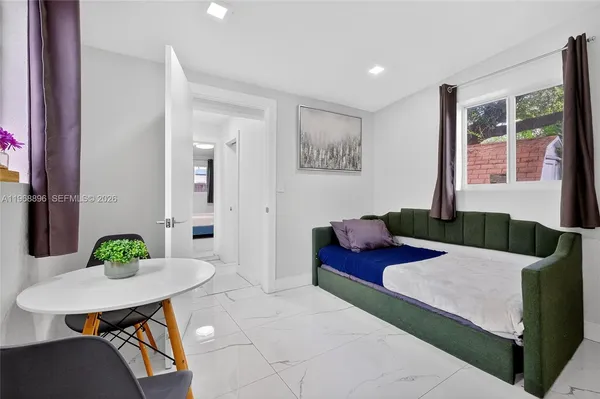 a kitchen with a refrigerator and microwave