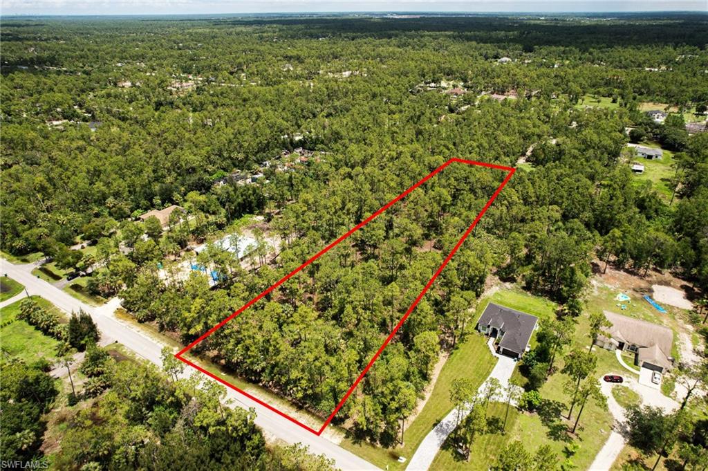 6 Ave Ne Naples Naples, FL 34102 - Photo 2 of 10 an aerial view of residential houses with outdoor space and trees