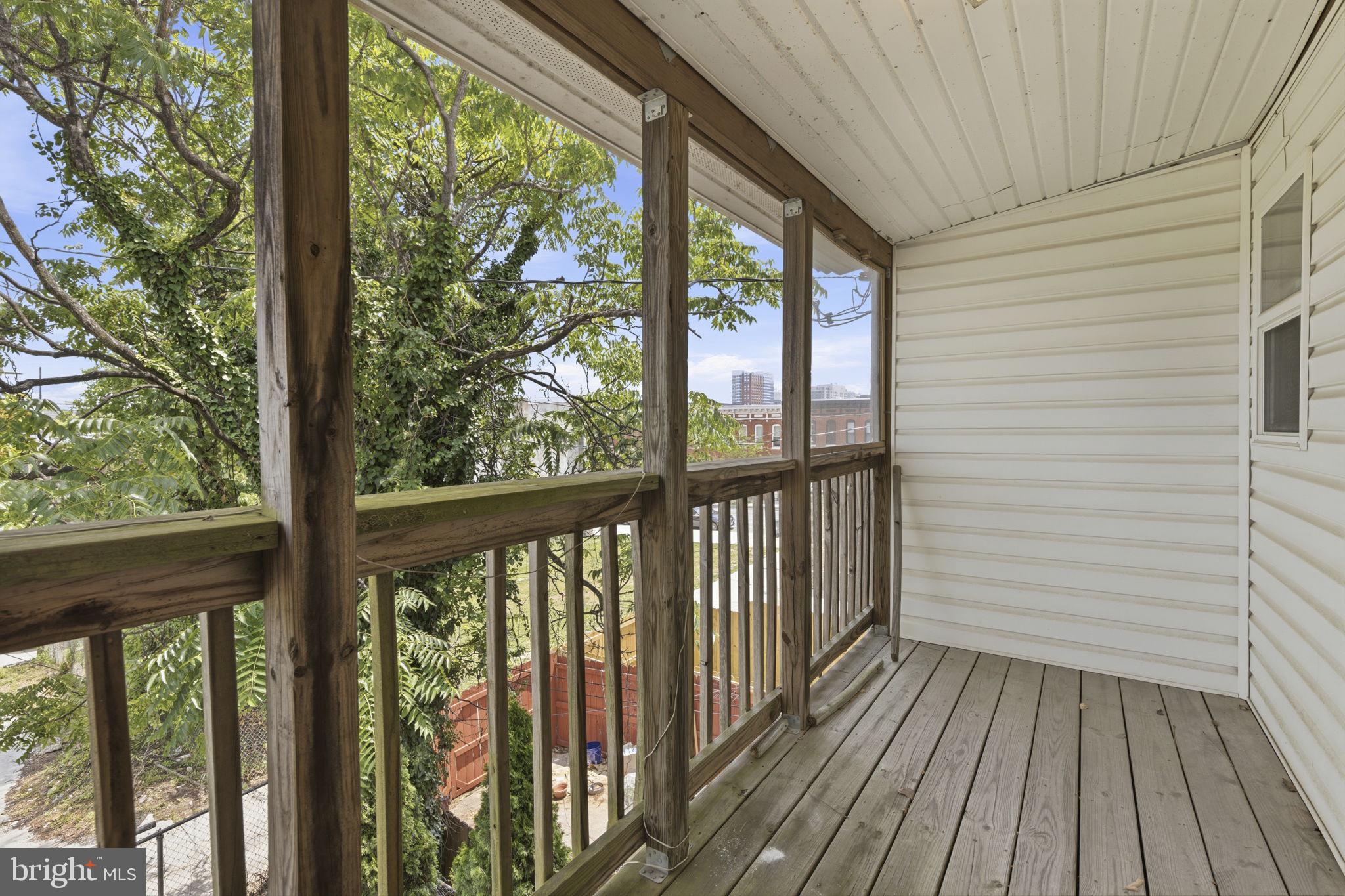 1311 North Broadway Baltimore, MD 21213 - Photo 15 of 24 Serene balcony with lush views.