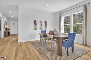 1127 Masters Place Way, Unit 164 Durham, NC 27703 - Photo 14 of 45 a view of a dining room with furniture window and wooden floor