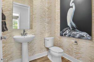 1127 Masters Place Way, Unit 164 Durham, NC 27703 - Photo 15 of 45 a bathroom with a sink toilet and mirror