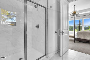 1127 Masters Place Way, Unit 164 Durham, NC 27703 - Photo 19 of 45 a bedroom with a bed a mirror and a shower