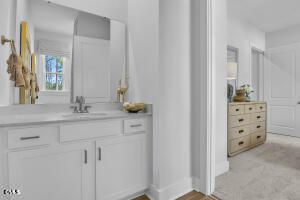 1127 Masters Place Way, Unit 164 Durham, NC 27703 - Photo 22 of 45 a bathroom with a sink and vanity