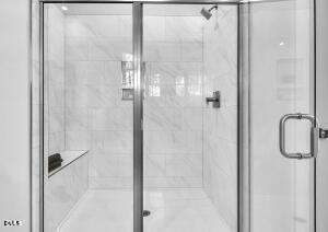 1127 Masters Place Way, Unit 164 Durham, NC 27703 - Photo 24 of 45 a bathroom with a glass shower door