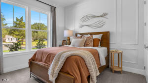 1127 Masters Place Way, Unit 164 Durham, NC 27703 - Photo 26 of 45 a bedroom with a bed and a window