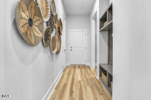 1127 Masters Place Way, Unit 164 Durham, NC 27703 - Photo 35 of 45 a view of a hallway with wooden floor and closet