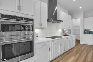 1127 Masters Place Way, Unit 164 Durham, NC 27703 - Photo 7 of 45 a kitchen with white cabinets and stainless steel appliances