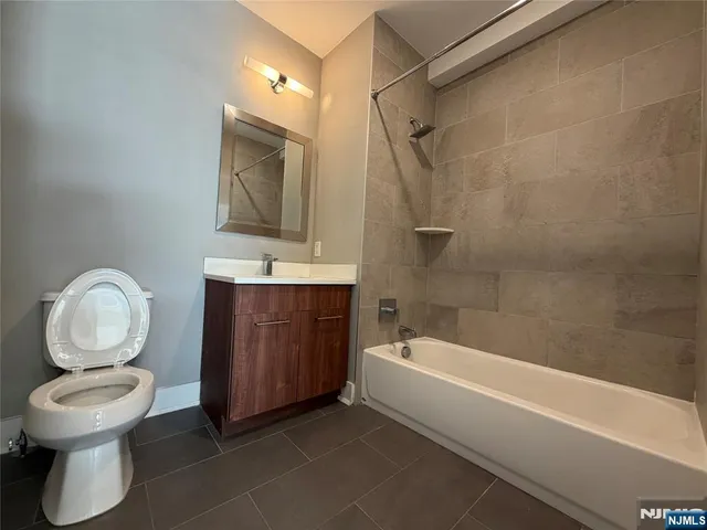 a bathroom with a sink a toilet and a bathtub