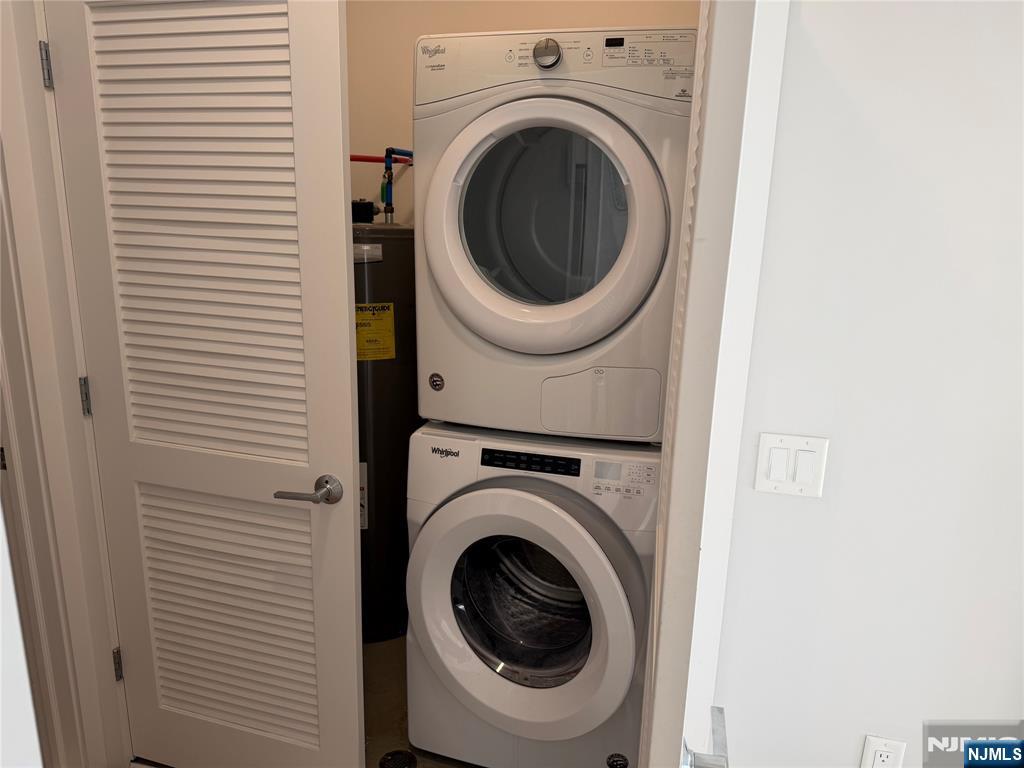 2150 North Central Road, Unit 410 Fort Lee, NJ 07024 - Photo 8 of 15 a utility room with dryer and washer