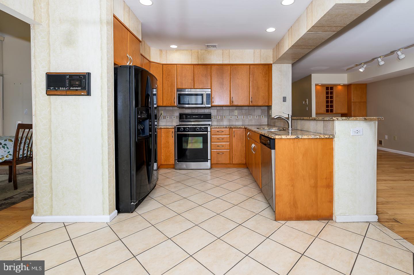 28 Stonebridge Lane Princeton, NJ 08540 - Photo 11 of 34 a kitchen with stainless steel appliances granite countertop a refrigerator and a stove
