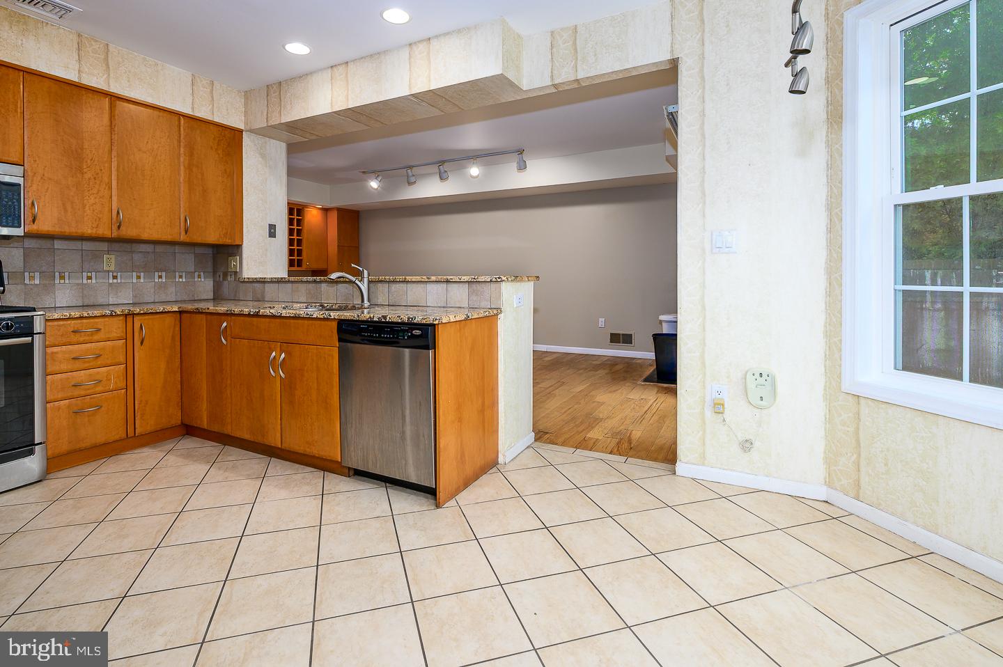 28 Stonebridge Lane Princeton, NJ 08540 - Photo 14 of 34 a kitchen with stainless steel appliances granite countertop a refrigerator and a sink