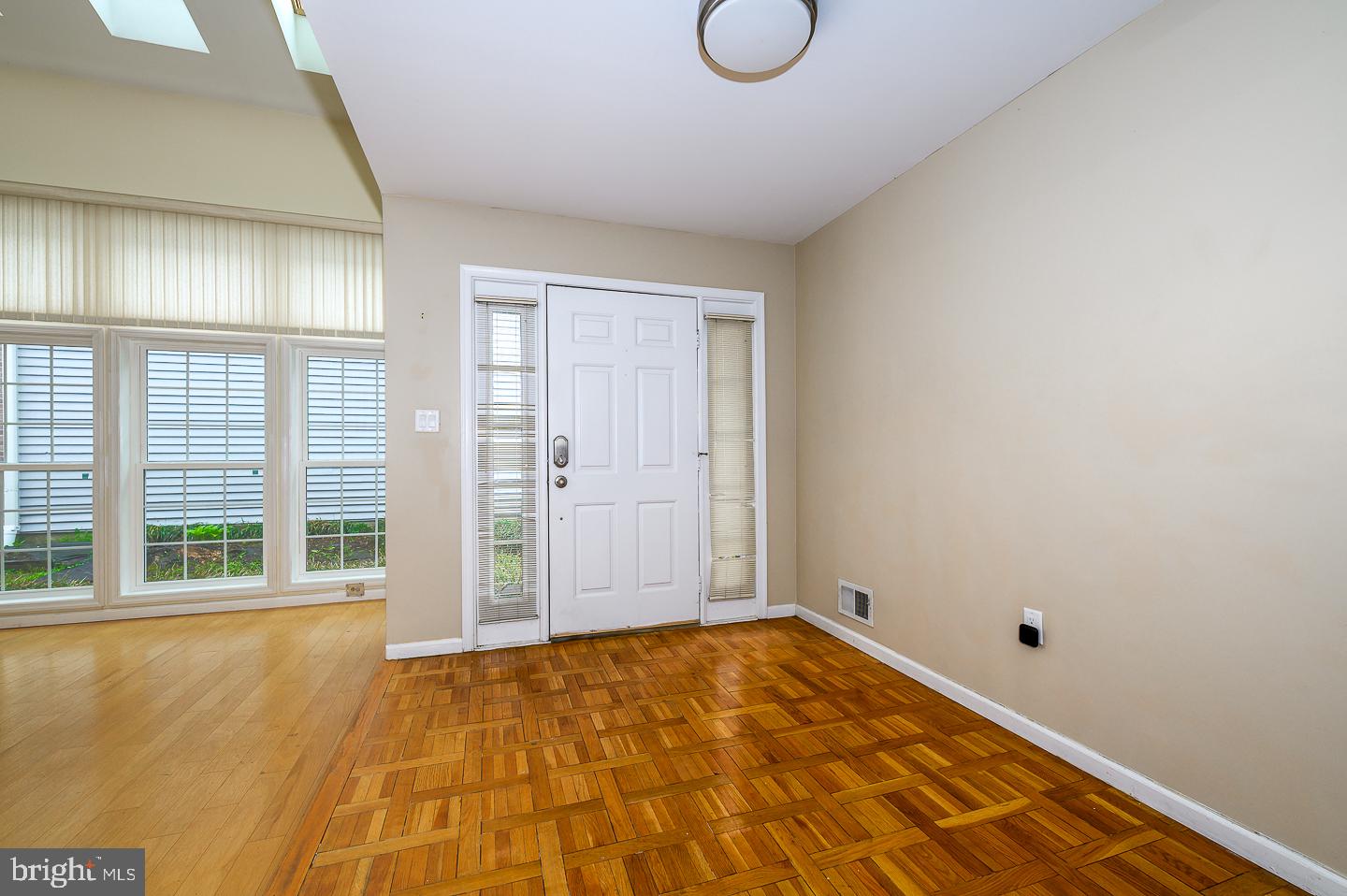 28 Stonebridge Lane Princeton, NJ 08540 - Photo 2 of 34 a view of an empty room with wooden floor and windows