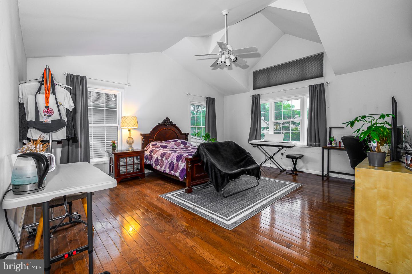 28 Stonebridge Lane Princeton, NJ 08540 - Photo 24 of 34 a living room with furniture a chandelier and a window
