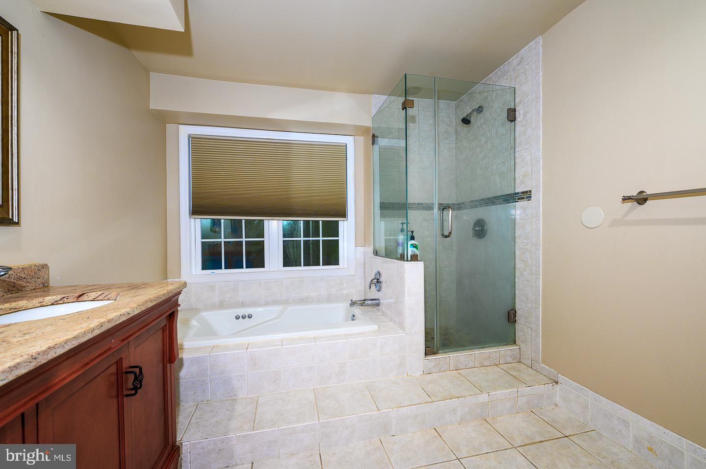28 Stonebridge Lane Princeton, NJ 08540 - Photo 28 of 34 a bathroom with a tub sink and mirror