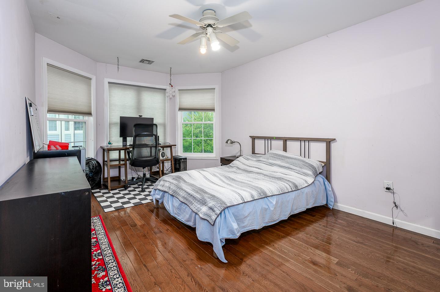 28 Stonebridge Lane Princeton, NJ 08540 - Photo 29 of 34 a bedroom with a bed window and a flat screen tv
