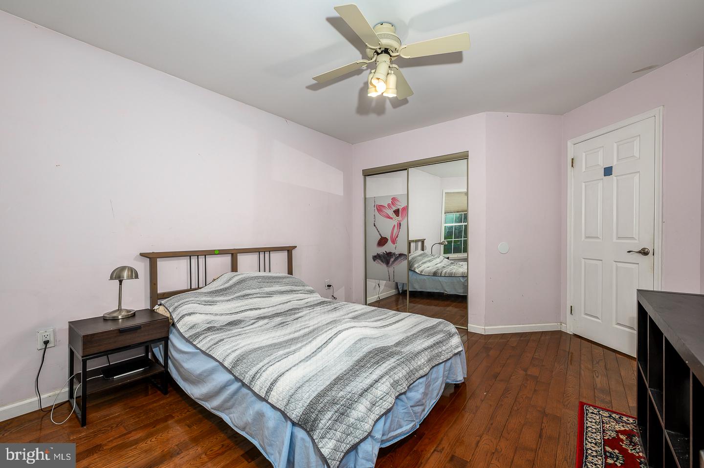 28 Stonebridge Lane Princeton, NJ 08540 - Photo 30 of 34 a bedroom with a bed and a chandelier