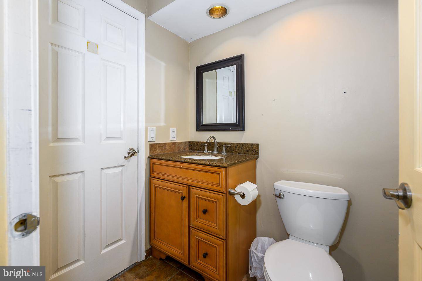 28 Stonebridge Lane Princeton, NJ 08540 - Photo 33 of 34 a bathroom with a toilet sink and mirror