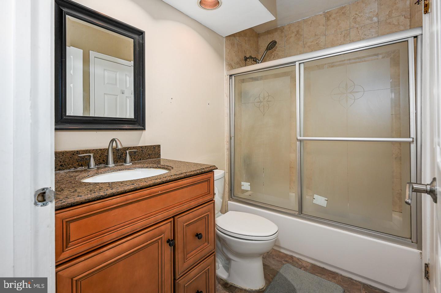 28 Stonebridge Lane Princeton, NJ 08540 - Photo 34 of 34 a bathroom with a granite countertop sink toilet and shower