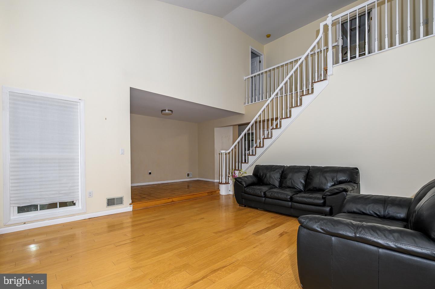 28 Stonebridge Lane Princeton, NJ 08540 - Photo 4 of 34 a living room with furniture and stairs