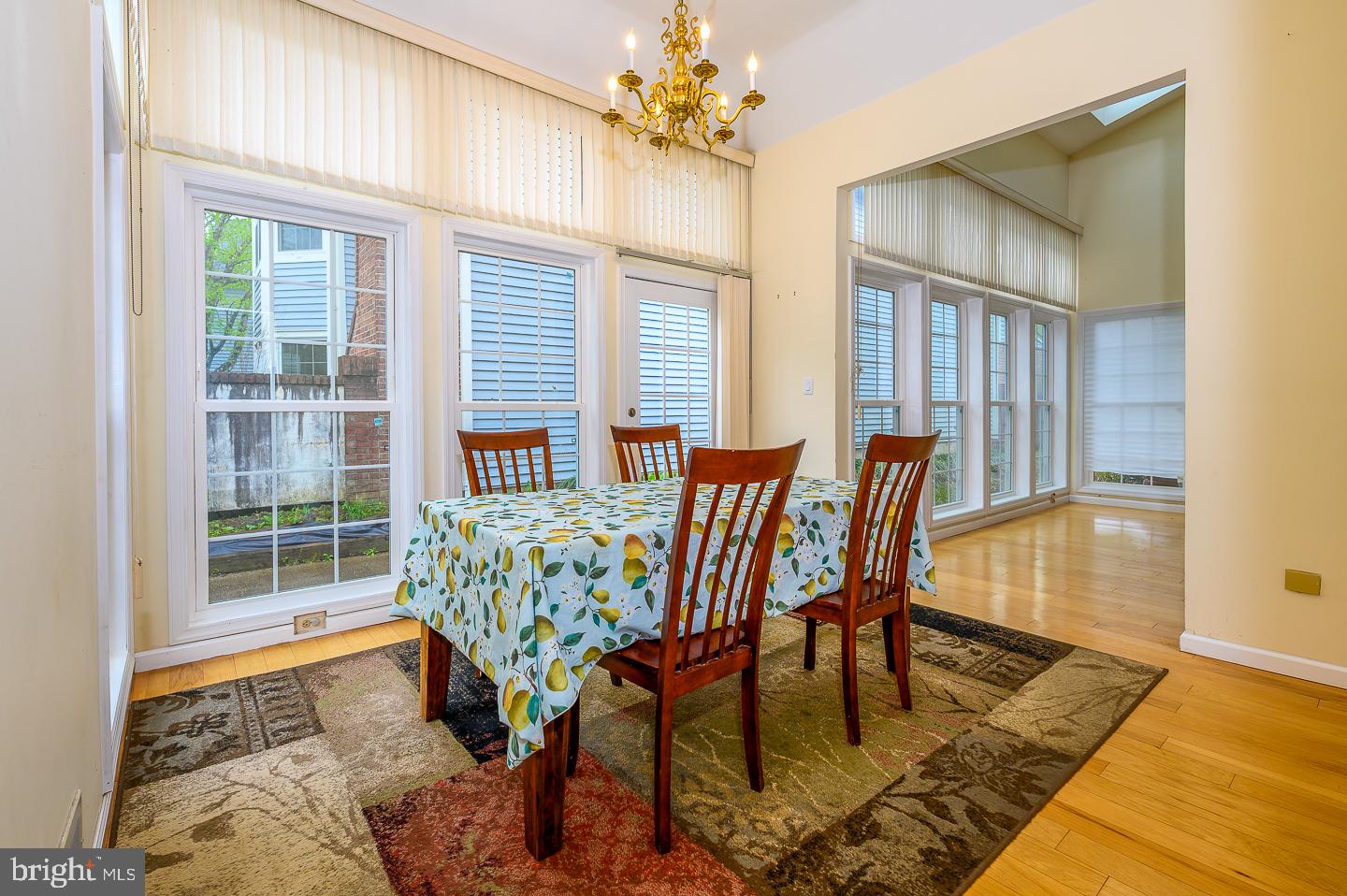 28 Stonebridge Lane Princeton, NJ 08540 - Photo 7 of 34 a dining room with furniture a chandelier and wooden floor