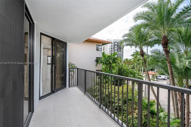 a view of a balcony with potted plants