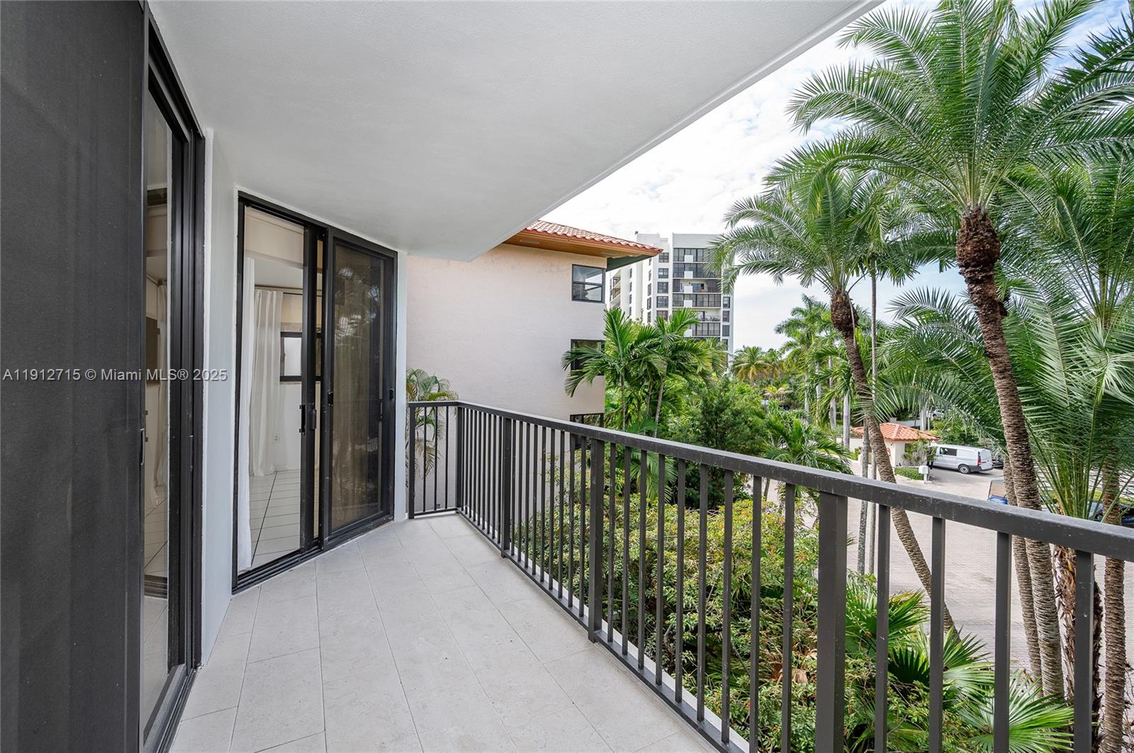 55 Ocean Ln Drive, Unit 3030 Key Biscayne, FL 33149 - Photo 12 of 22 a view of a balcony with potted plants