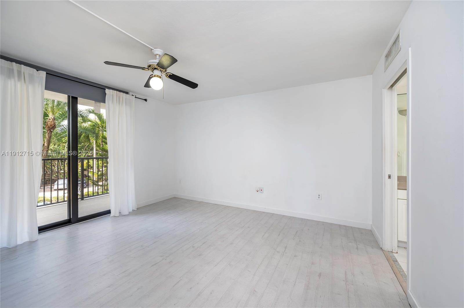 55 Ocean Ln Drive, Unit 3030 Key Biscayne, FL 33149 - Photo 13 of 22 wooden floor in an empty room with a window