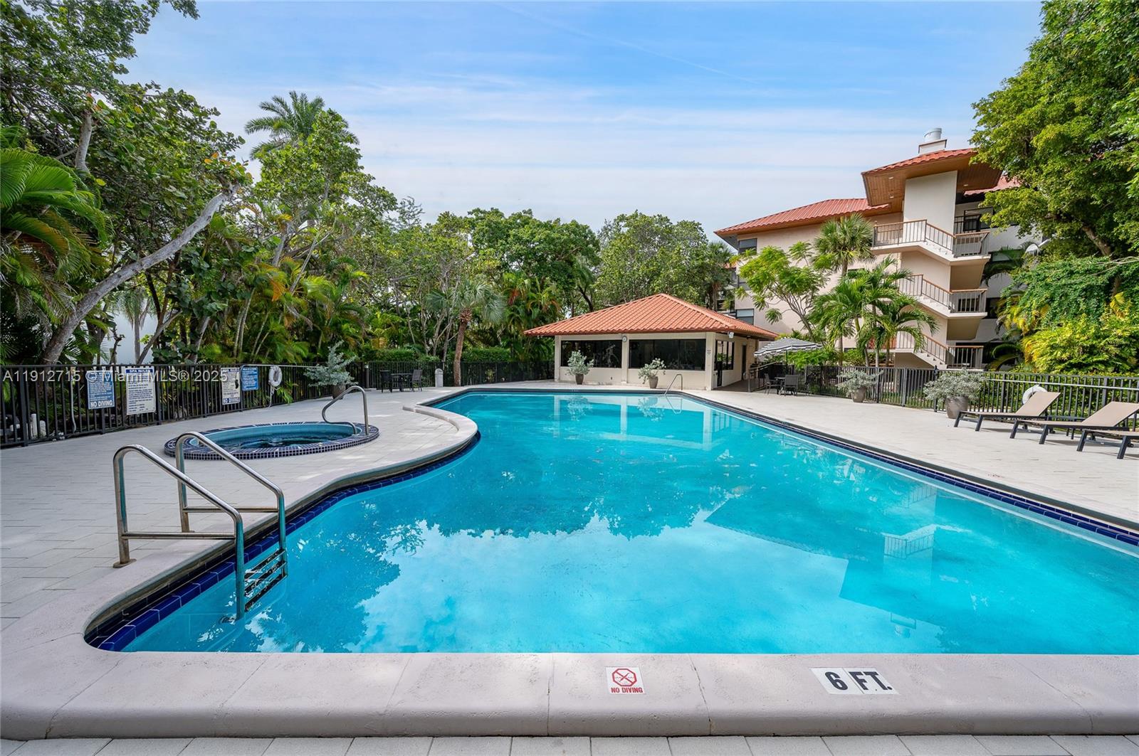 55 Ocean Ln Drive, Unit 3030 Key Biscayne, FL 33149 - Photo 19 of 22 a swimming pool with outdoor seating and yard