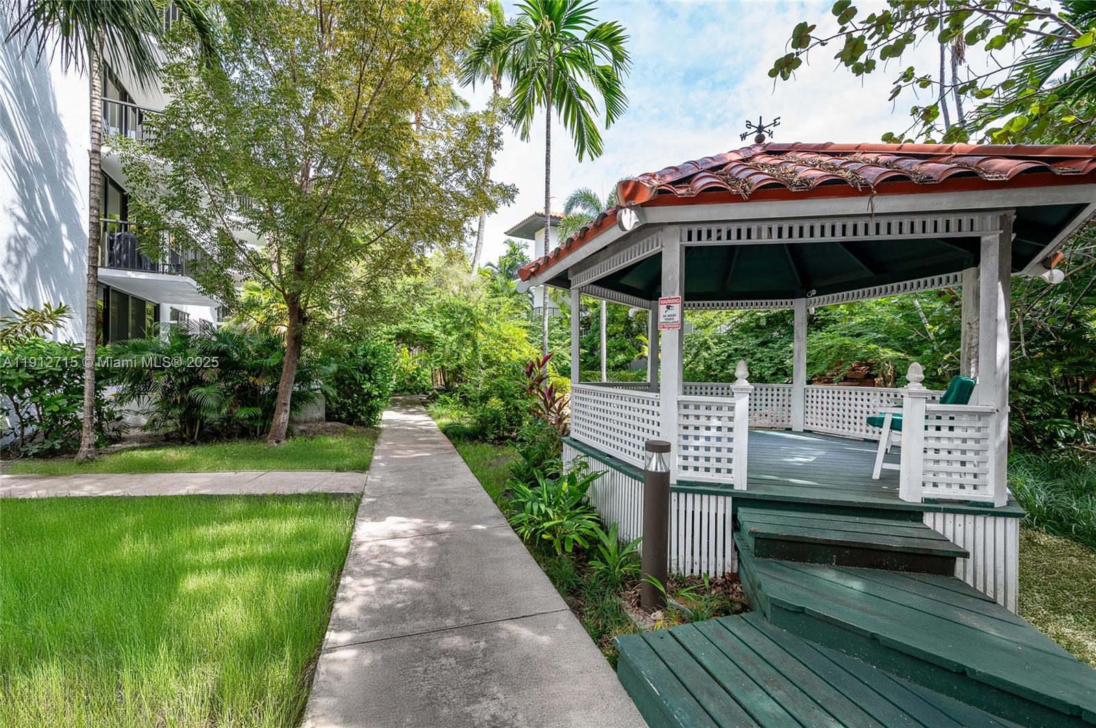 55 Ocean Ln Drive, Unit 3030 Key Biscayne, FL 33149 - Photo 5 of 22 a porch with seating space and yard