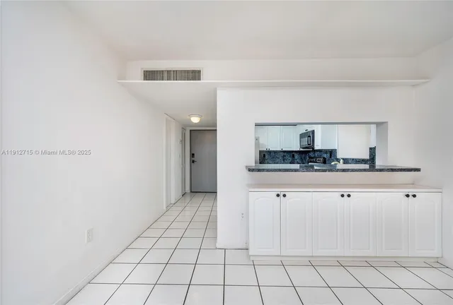a kitchen with stainless steel appliances a sink and cabinets