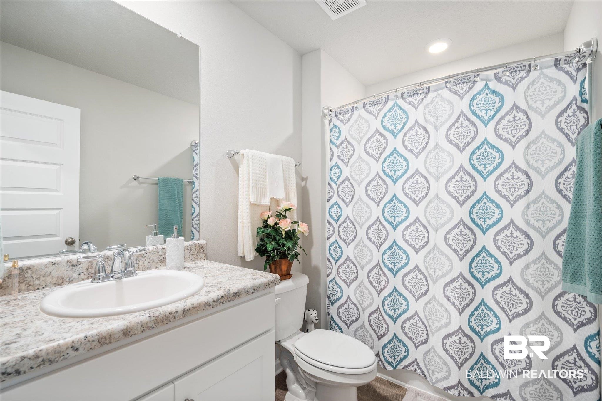 446 Paget Drive East Mobile, AL 36608 - Photo 14 of 20 Bathroom featuring a shower with shower curtain, vanity, and toilet