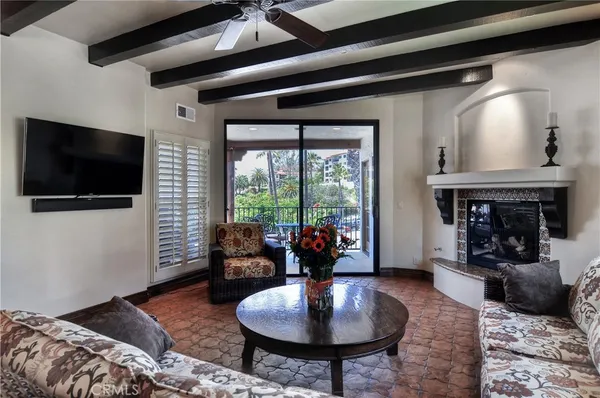 a kitchen with stainless steel appliances granite countertop a sink a stove and refrigerator