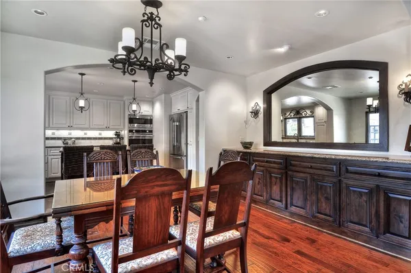 a view of a dining room with furniture and wooden floor