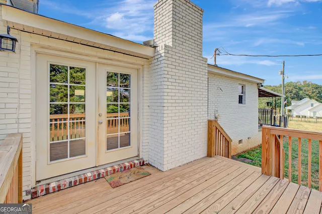 a view of a house with wooden floor and iron stairs