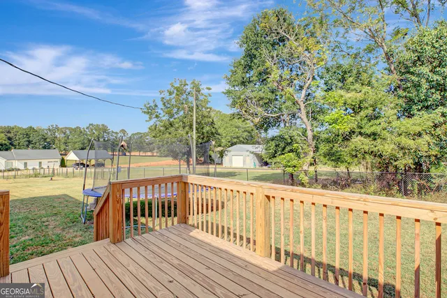 a view of a balcony with wooden floor
