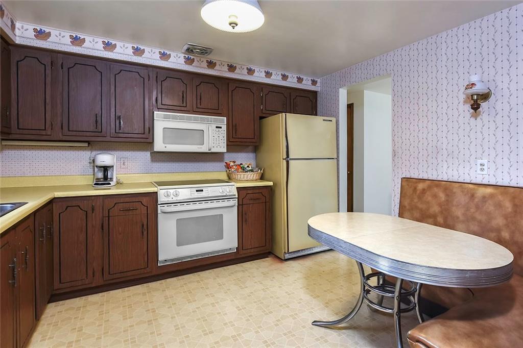 502 Springdale Road Eighty Four, PA 15330 - Photo 11 of 24 Vintage Eat-In-Kitchen with laminate flooring, well maintained wood cabinetry and plenty of counter space. Refrigerator, Electric Oven, Dishwasher and Disposal are included.