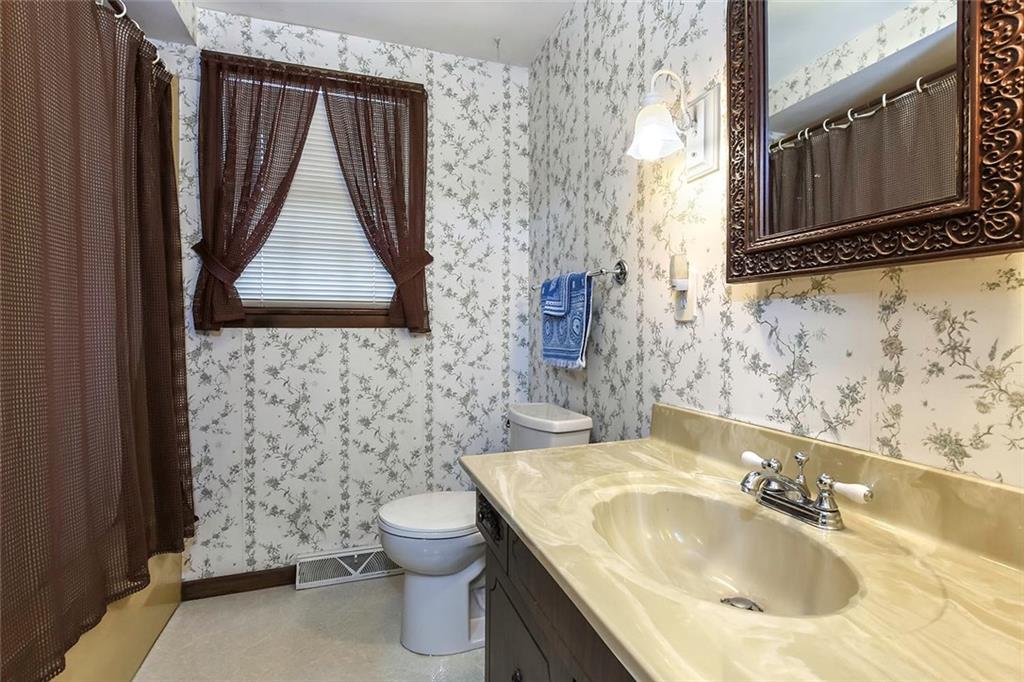 502 Springdale Road Eighty Four, PA 15330 - Photo 17 of 24 The Main Hallway has 3 closets and leads to a Full Bathroom with laminate flooring, marble vanity top, window, tub/shower plus a linen closet.