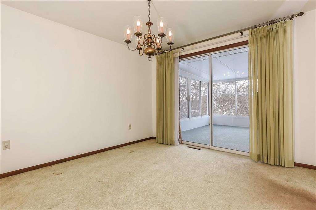 502 Springdale Road Eighty Four, PA 15330 - Photo 6 of 24 Dining Room is spacious with neutral carpet, chandelier and opens to Main Level Sun Room.