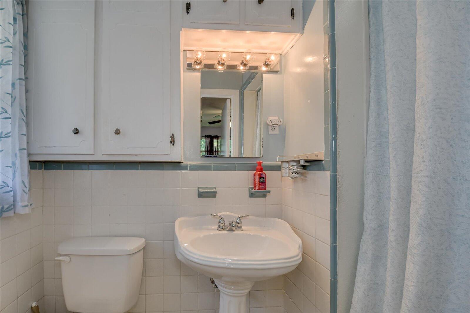 308 5th Street Jackson, SC 29831 - Photo 30 of 70 a bathroom with a sink a toilet and mirror