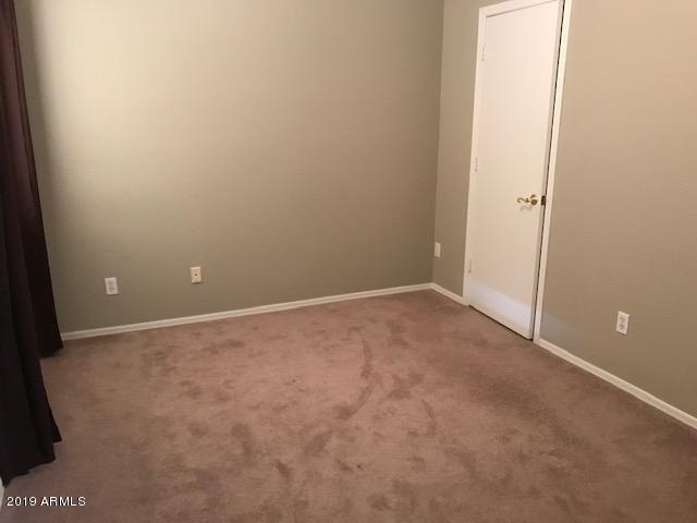 8940 West Olive Avenue, Unit 15 Peoria, AZ 85345 - Photo 6 of 9 a view of an empty room