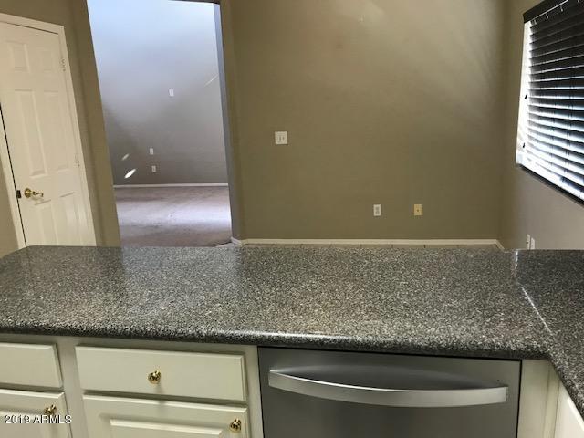8940 West Olive Avenue, Unit 15 Peoria, AZ 85345 - Photo 7 of 9 a view of granite counter top