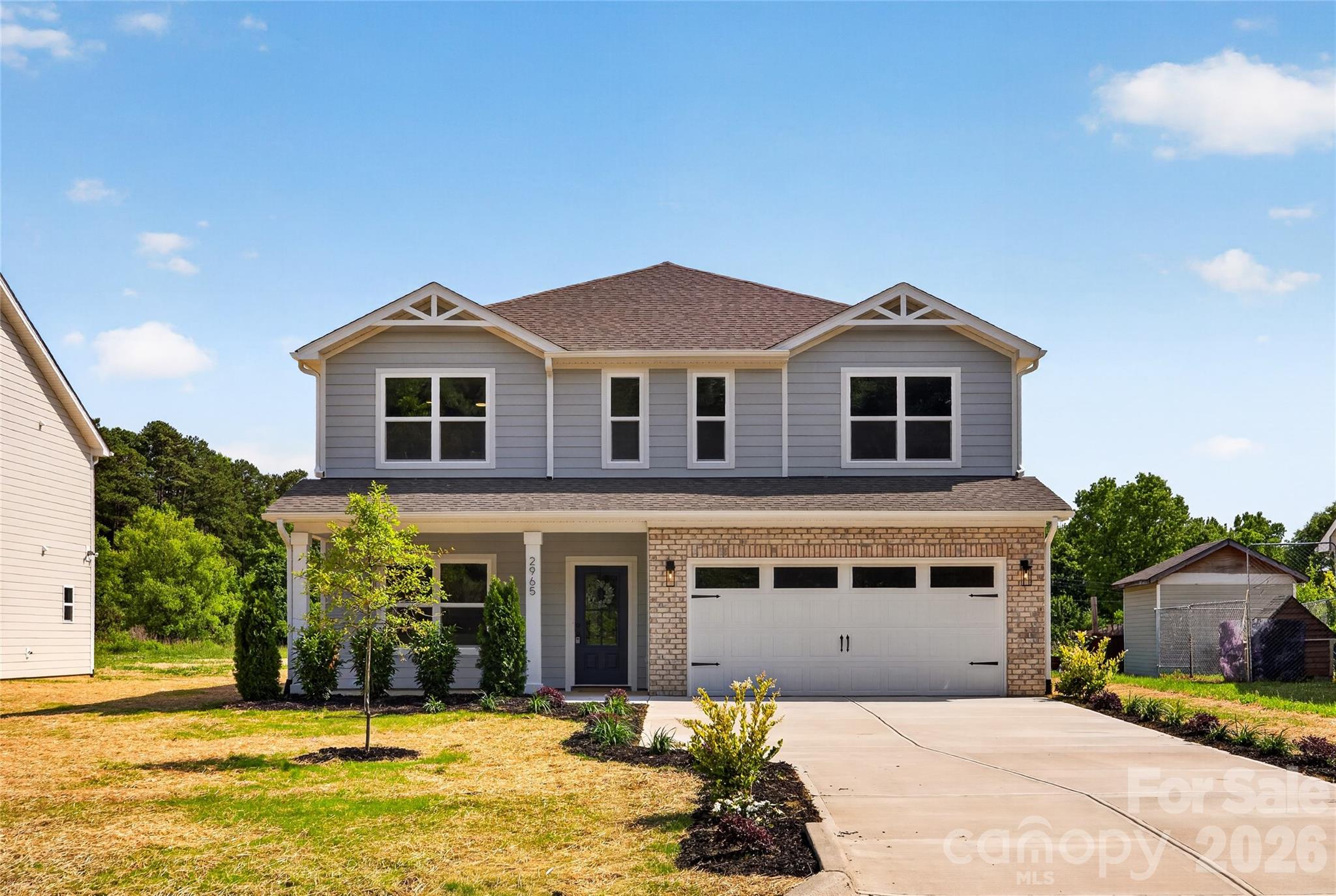 2965 Polk And White Road Charlotte, NC 28269 - Photo 1 of 38 a front view of a house with a yard