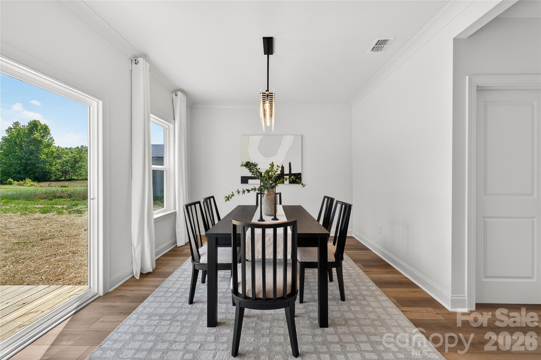 2965 Polk And White Road Charlotte, NC 28269 - Photo 12 of 38 a view of a dining room with furniture window and wooden floor