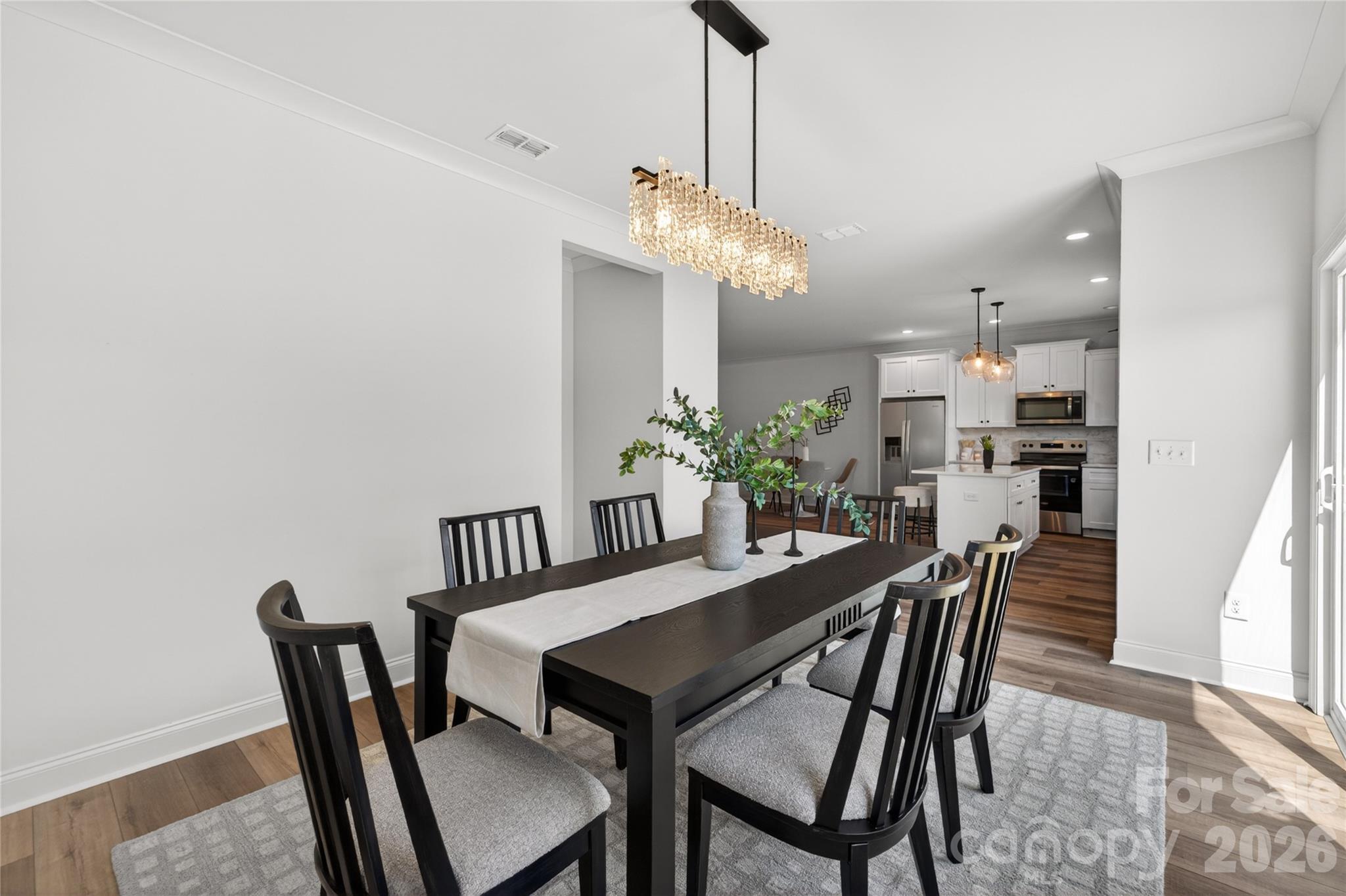 2965 Polk And White Road Charlotte, NC 28269 - Photo 13 of 38 a view of a dining room with furniture and chandelier